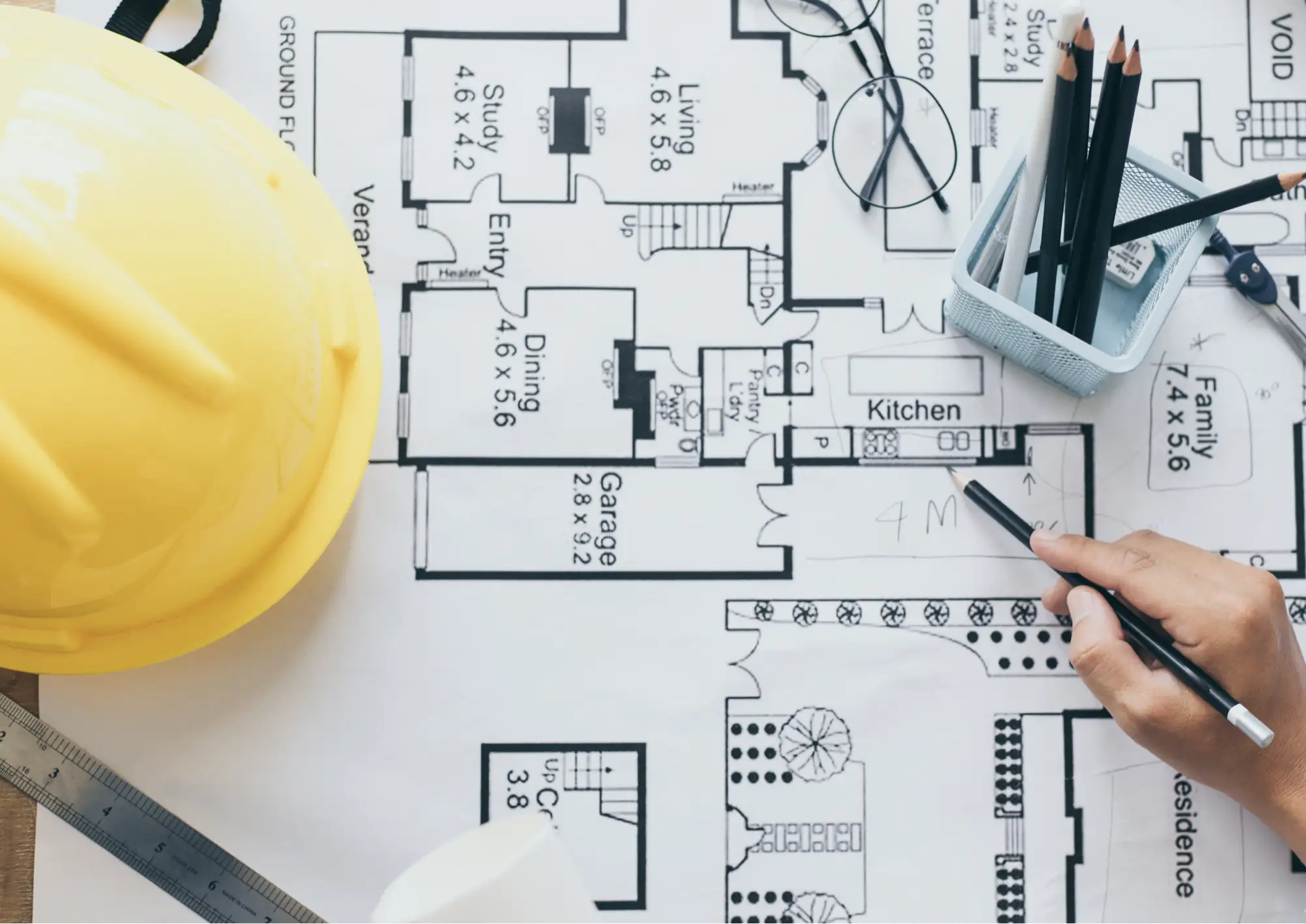 Architectural blueprint with a hard hat